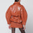 Veste ceinturée couleur cuir en simili-cuir
