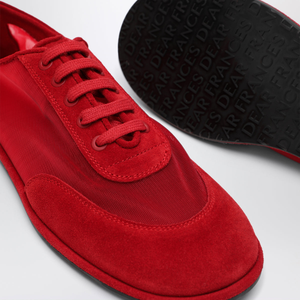 Sneakers rosse in mesh semitrasparente e suede