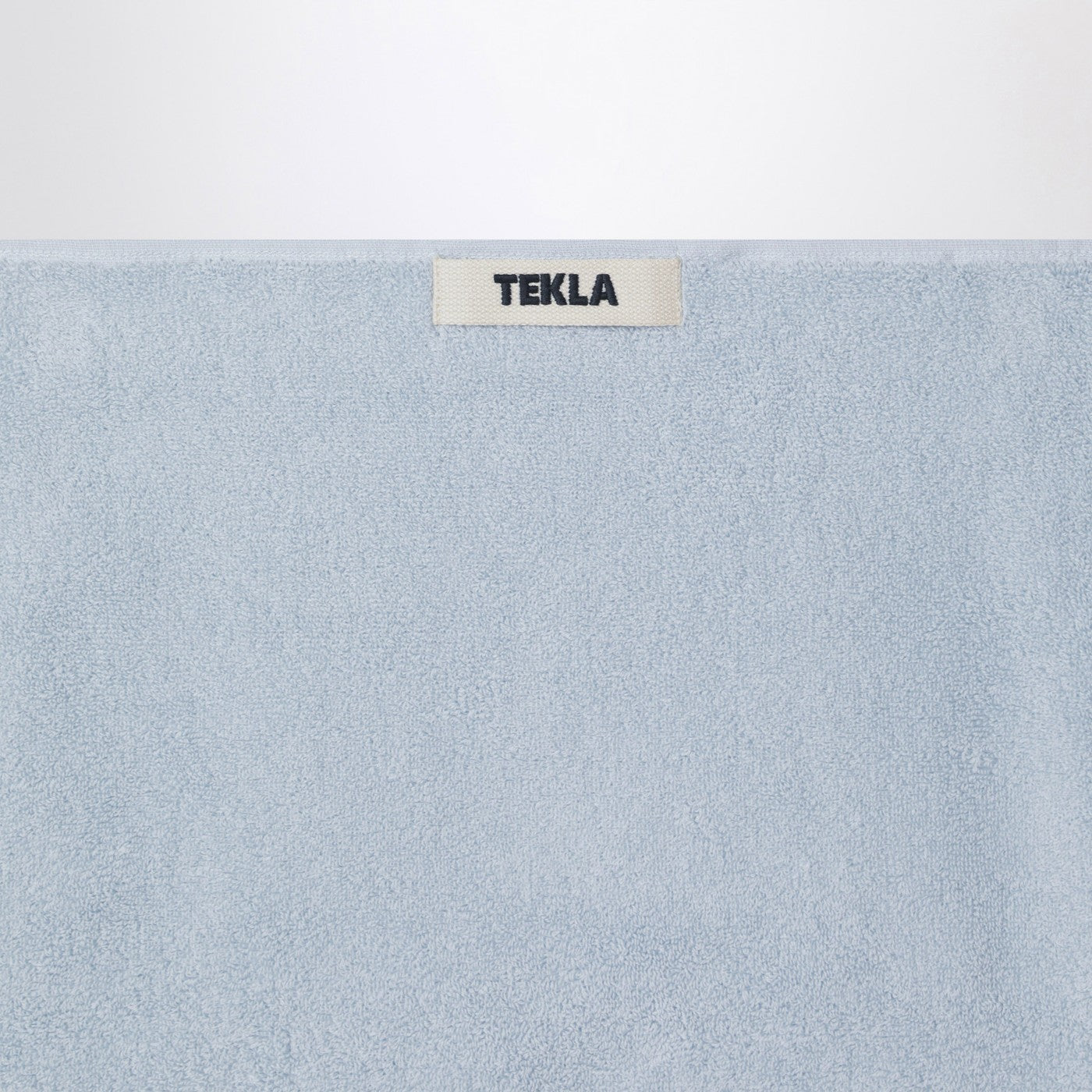Telo bagno azzurro a righe 50x90