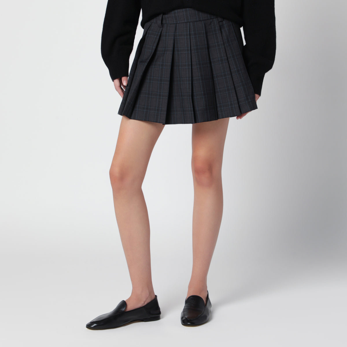 Mini-jupe plissée à motif check en mélange de laine