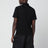 Polo nera in cotone stretch e Re-Nylon