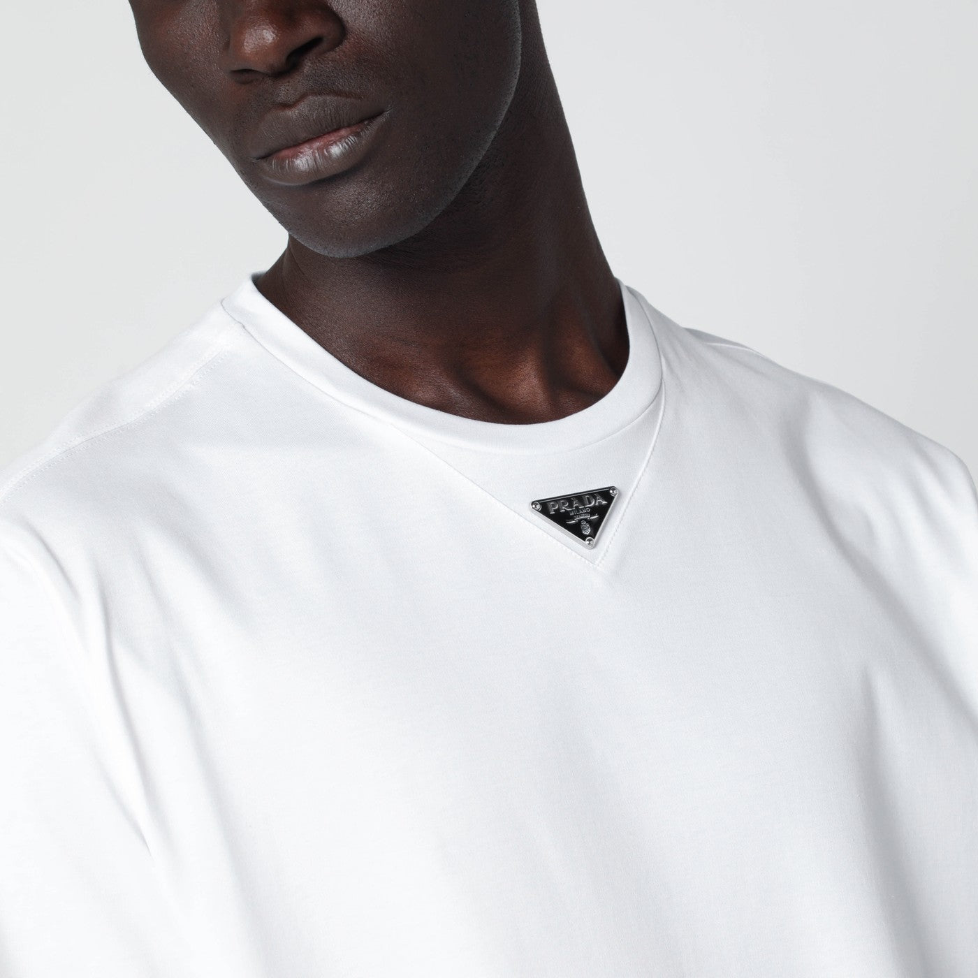 White T-shirt with triangle logo