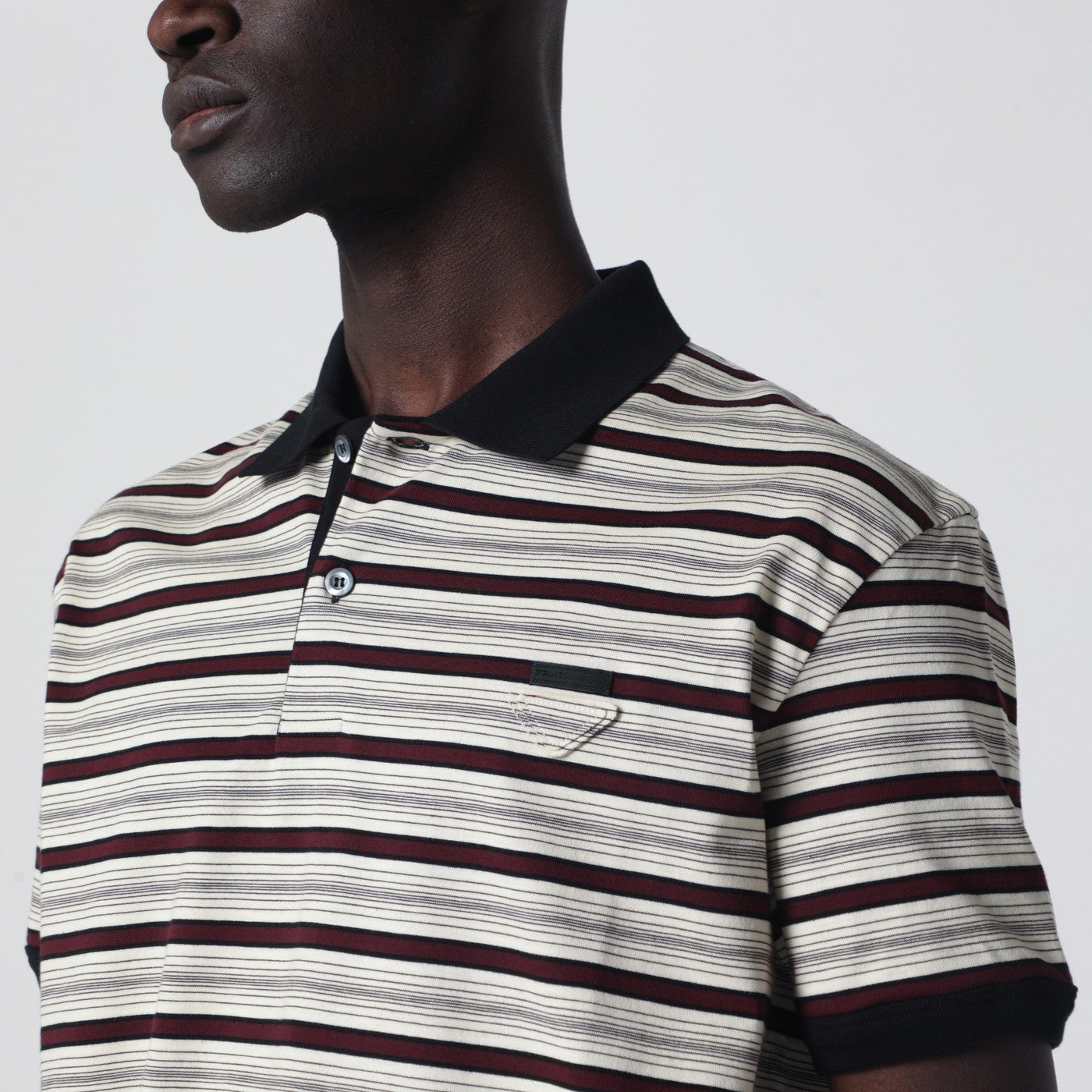Polo avorio/granato a righe in cotone