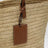Raffia and leather shoulder bag