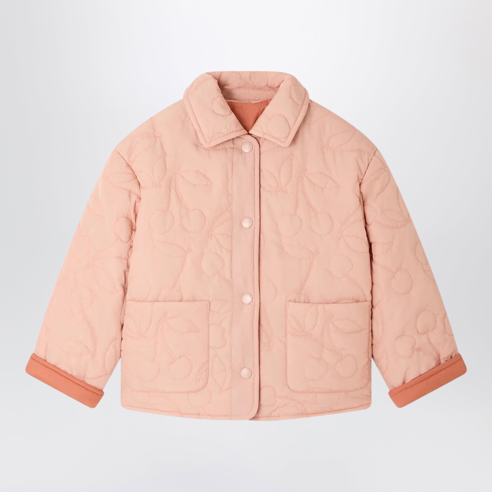 Pink reversible quilted Molly jacket with cherries
