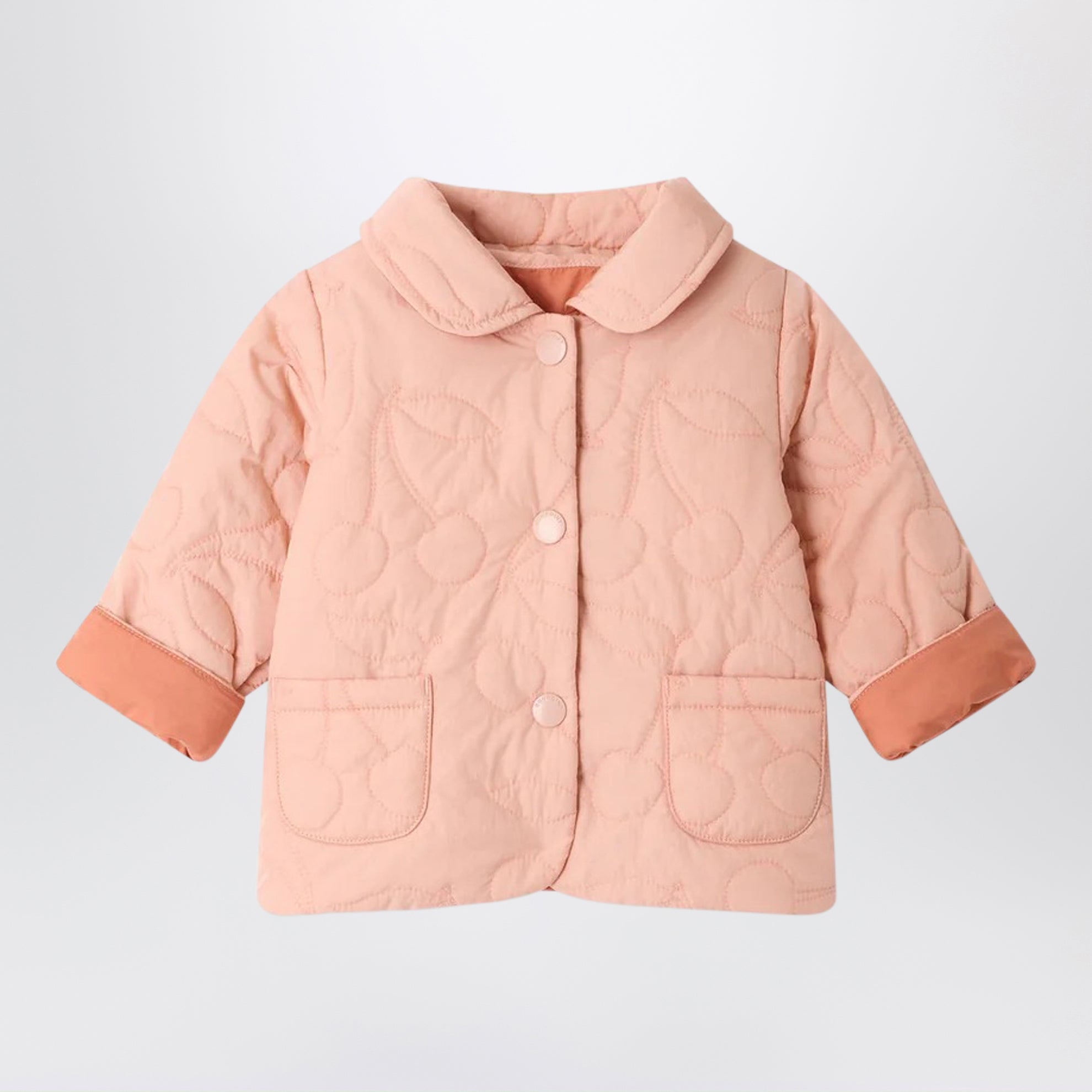 Reversible Juno quilted jacket in pink with cherry motif