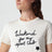 Cremefarbenes T-Shirt aus Baumwolle mit Logoprint