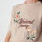 Pull en coton sable brodé