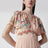 Langes Kleid in Puderrosa mit floralem Print