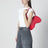 Double-D patent leather shoulder bag in red
