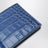 Portefeuille bifold bleu en cuir brillant effet crocodile